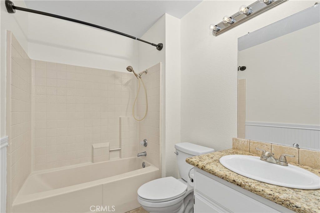 42329 Via Consuelo, Temecula, CA 92592 Additional full bathroom featuring a tub and shower combination, granite-topped vanity, and convenient storage.