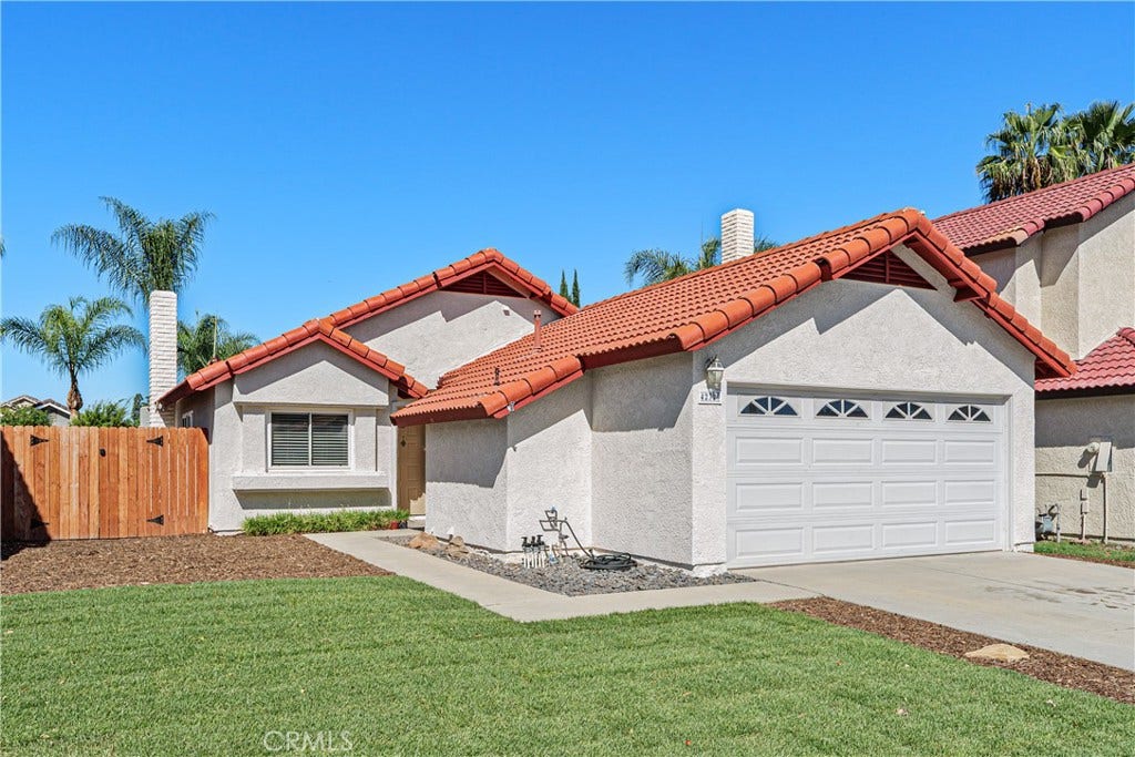 42329 Via Consuelo, Temecula, CA 92592 An additional exterior view highlights the home's attractive rooflines, spacious driveway, and welcoming curb appeal.