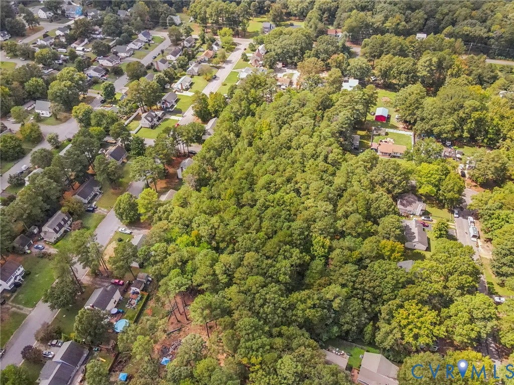 View of property location with a forest