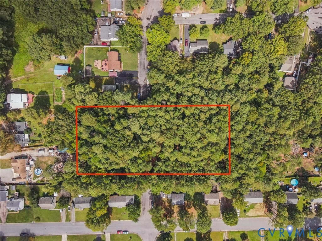 Aerial view of residential area with property parcel outlined
