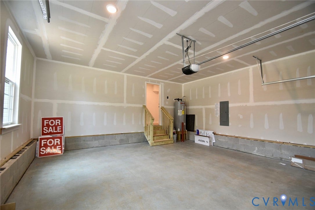 53 Porkchop Court, Louisa, VA 23093 Attached garage with a concrete floor, built-in window, and recessed lighting