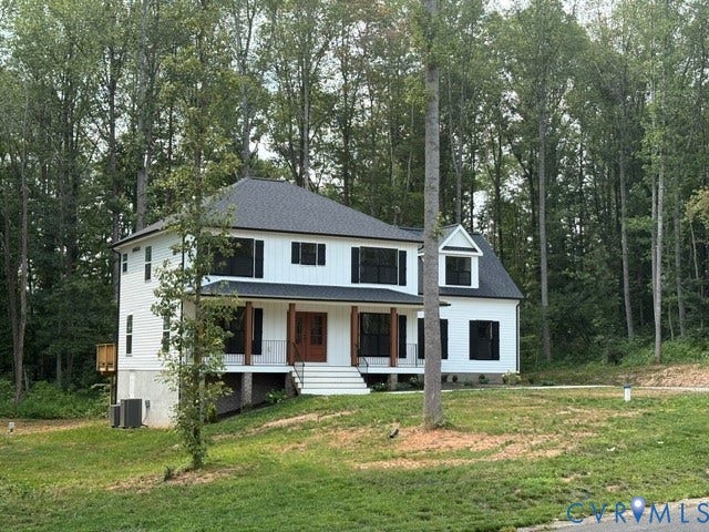 53 Porkchop Court, Louisa, VA 23093 White siding exterior with a dark shingle roof, covered front porch with substantial columns, and a prominent dormer