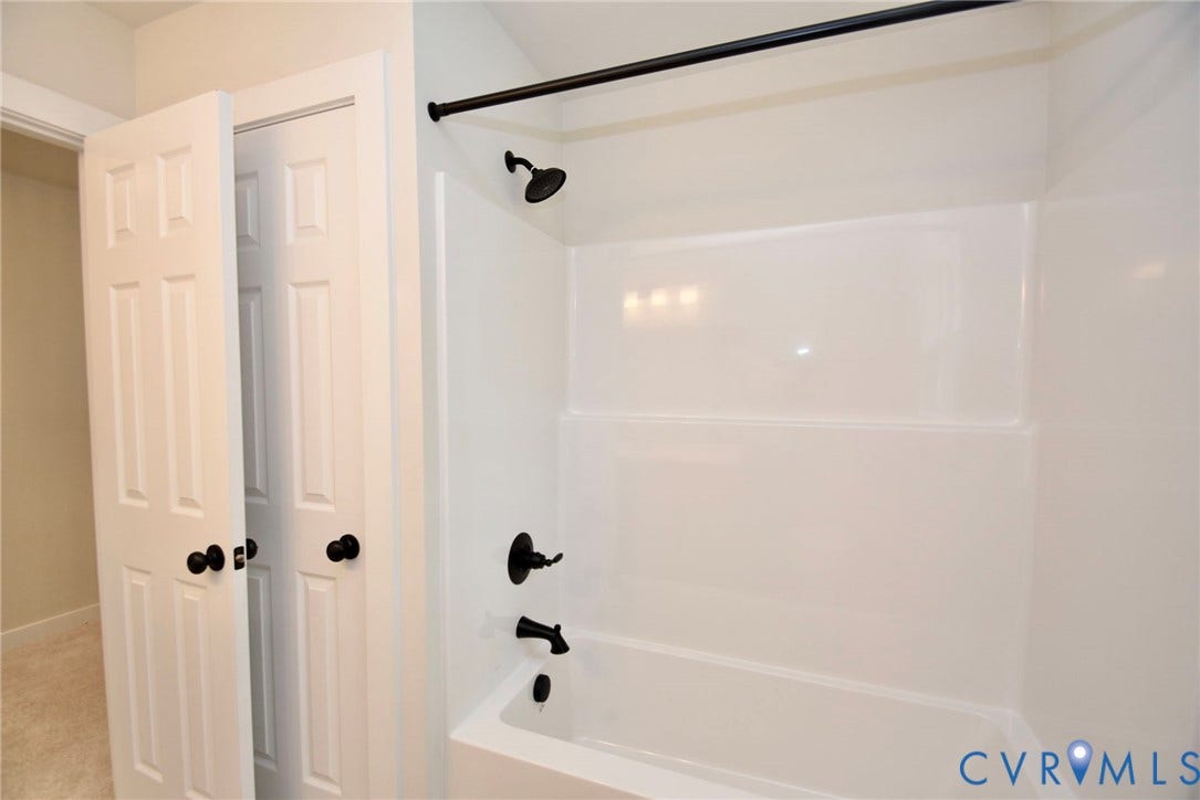 53 Porkchop Court, Louisa, VA 23093 White tub and shower combination with dark bronze fixtures