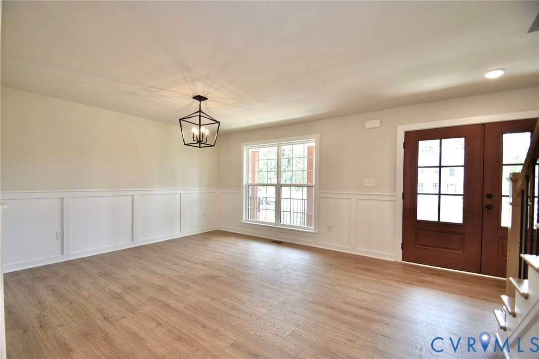 53 Porkchop Court, Louisa, VA 23093 Wood-finish flooring, wainscoting, double entry doors with glass panels, recessed lighting, and a suspended geometric light fixture