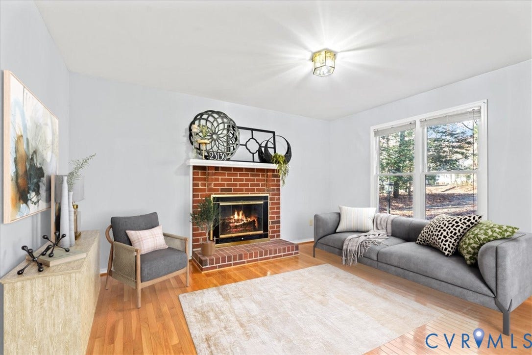 2739 Ridgeview Road, Spencerwood West, Powhatan, VA 23139 Living room featuring a fireplace and light wood floors