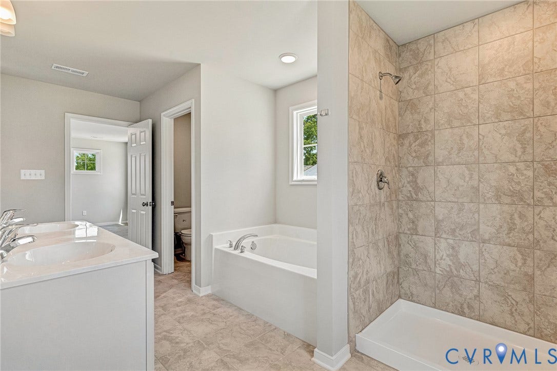 11105 Somerset Bluff Court, Somerset Hills, Glen Allen, VA 23059 Dual vanity with undermount sinks, separate soaking tub, walk-in shower with tile surround, and tiled flooring