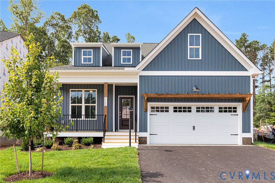 Blue vertical siding exterior featuring white trim accents