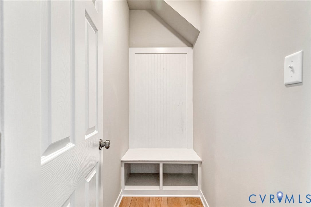 12606 Poplar Village Place, Poplar Village, Chester, VA 23831 Built-in white beadboard bench with lower storage cubbies and wood-finish flooring