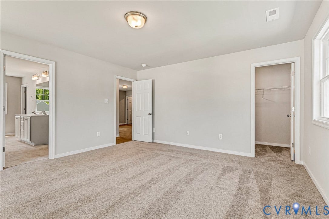 12606 Poplar Village Place, Poplar Village, Chester, VA 23831 Spacious room featuring neutral carpet flooring, light gray wall paint, and white trim