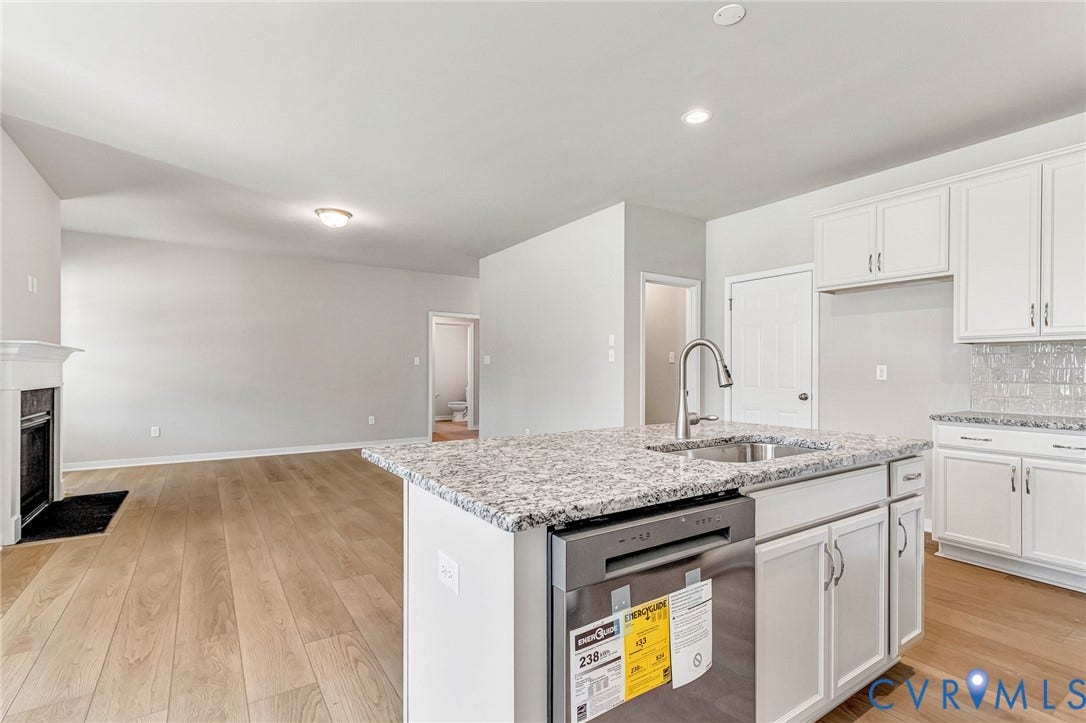 12606 Poplar Village Place, Poplar Village, Chester, VA 23831 Kitchen island with an undermount sink and stainless steel dishwasher