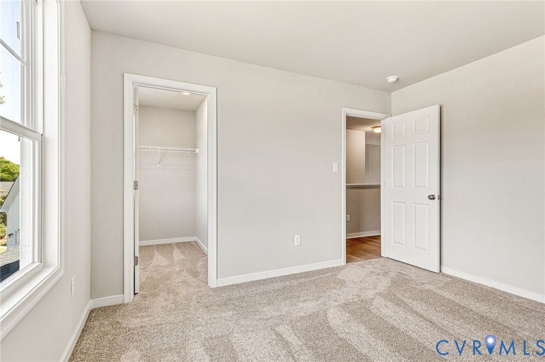 12606 Poplar Village Place, Poplar Village, Chester, VA 23831 Carpeted room with neutral wall tones and a double-pane window