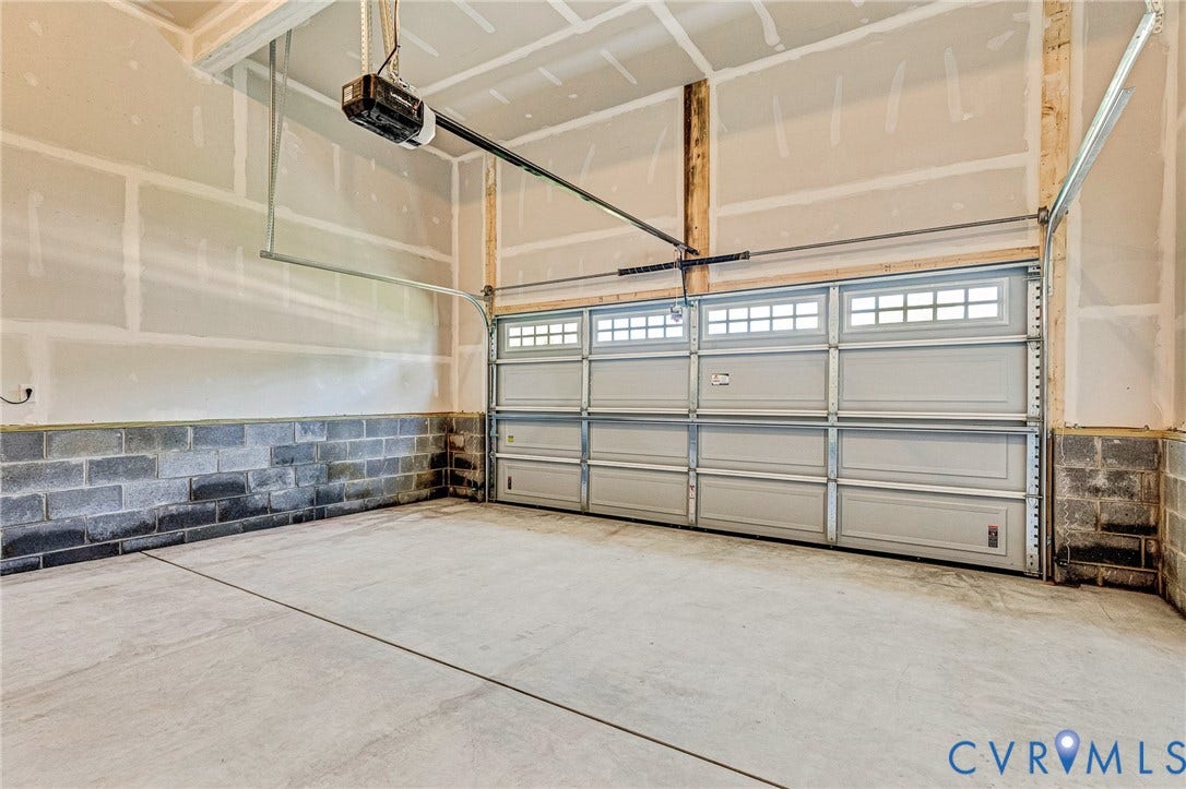 12606 Poplar Village Place, Poplar Village, Chester, VA 23831 Concrete flooring with a dual bay garage door, automatic opener, and block wall foundation