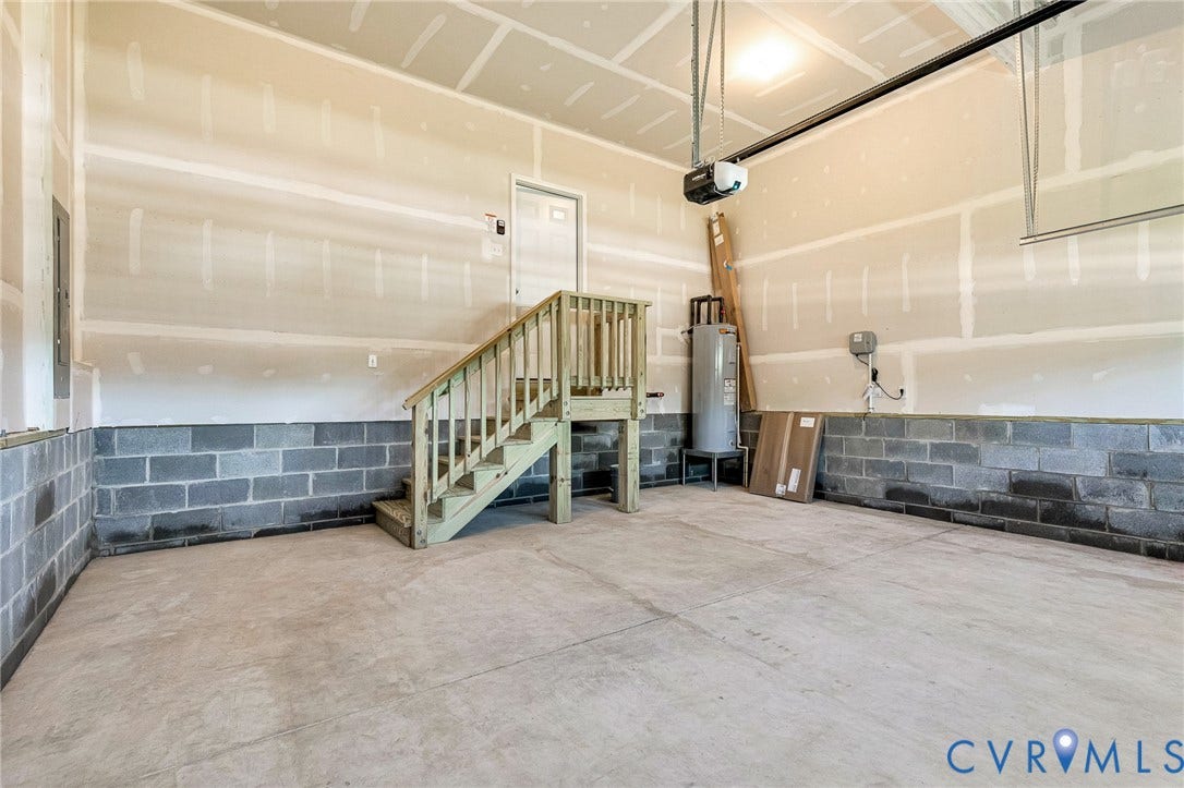 12606 Poplar Village Place, Poplar Village, Chester, VA 23831 Spacious garage with concrete block foundation walls and unfinished drywall above