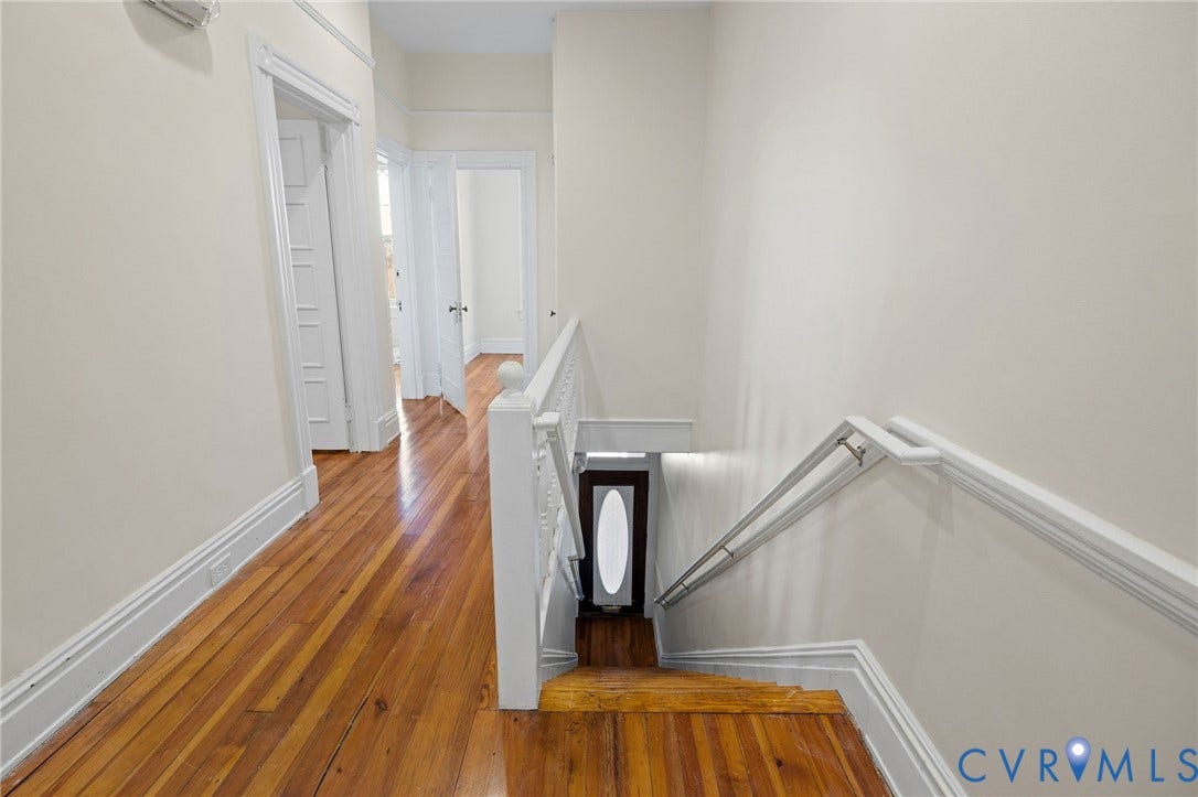 5 S Adams Street, Richmond, VA 23220 Corridor featuring an upstairs landing and dark wood-style flooring