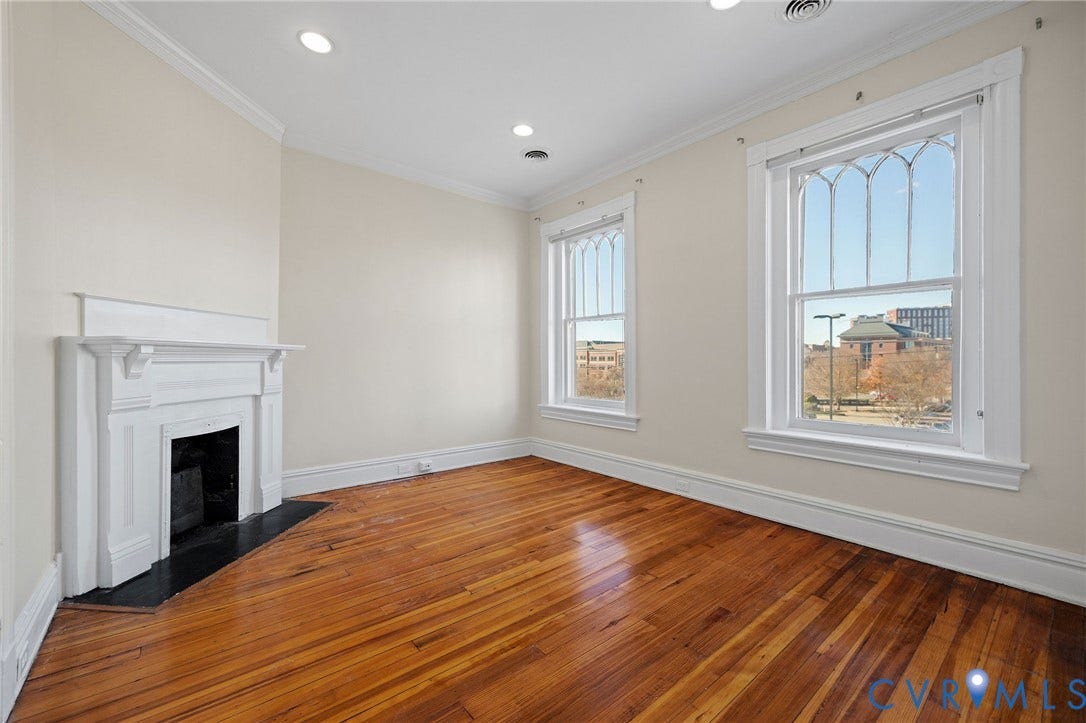 5 S Adams Street, Richmond, VA 23220 Unfurnished living room featuring crown molding, a fireplace, hardwood / wood-style floors, and recessed lighting