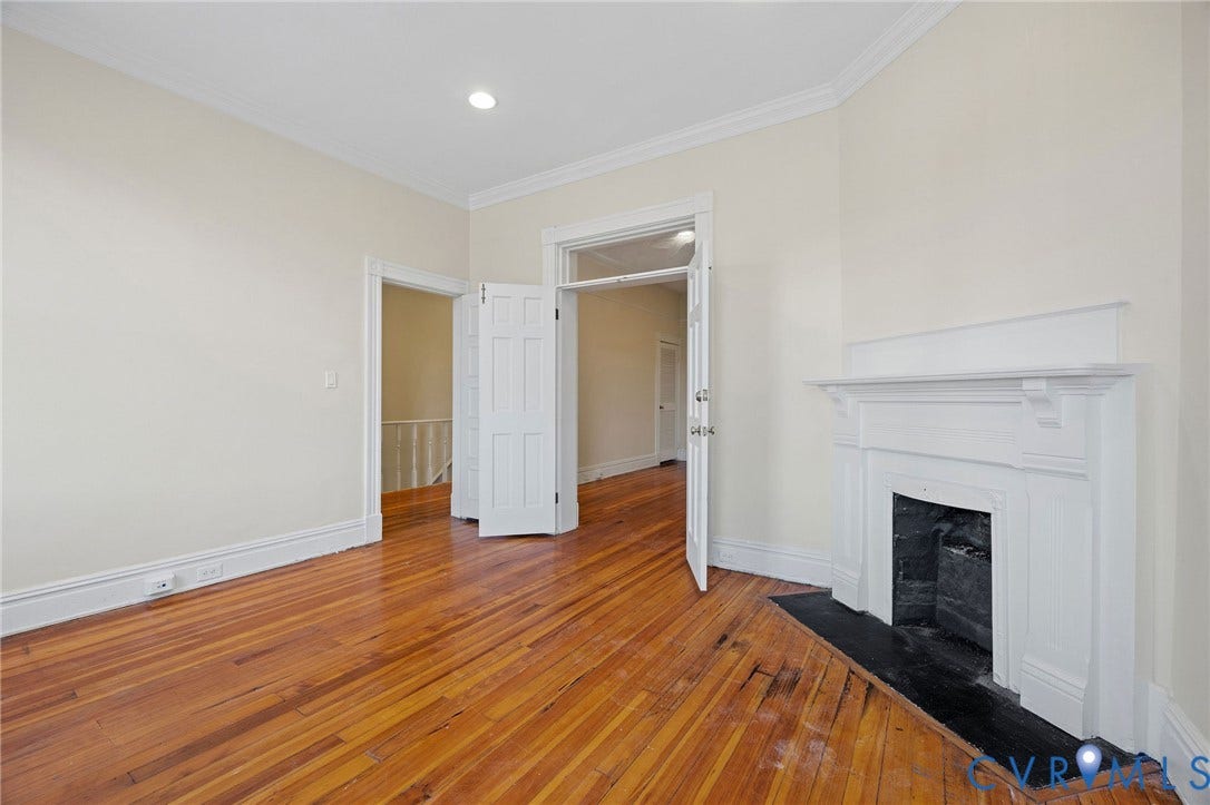 5 S Adams Street, Richmond, VA 23220 Unfurnished living room featuring hardwood / wood-style flooring, a fireplace with flush hearth, ornamental molding, and recessed lighting