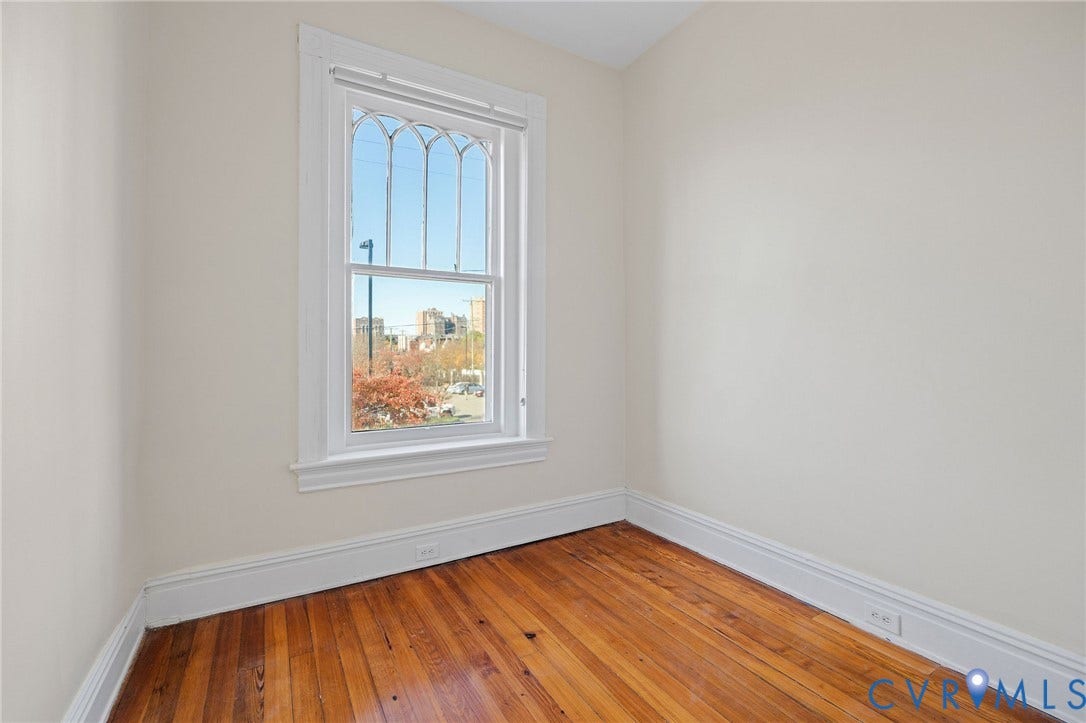 5 S Adams Street, Richmond, VA 23220 Unfurnished room with baseboards and wood-type flooring