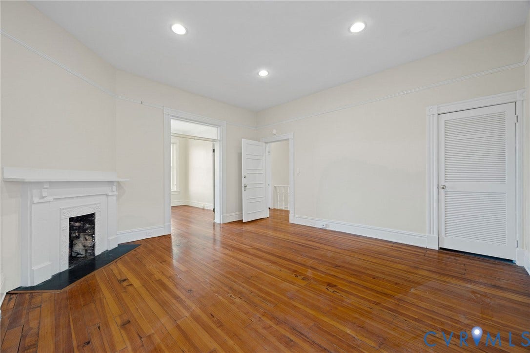 5 S Adams Street, Richmond, VA 23220 Unfurnished living room with dark wood-type flooring, a fireplace, and recessed lighting