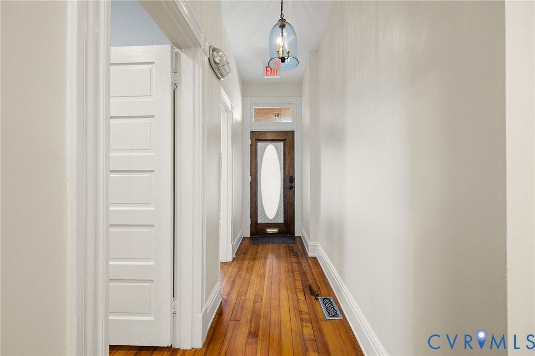 5 S Adams Street, Richmond, VA 23220 Corridor with a chandelier and dark wood-style flooring