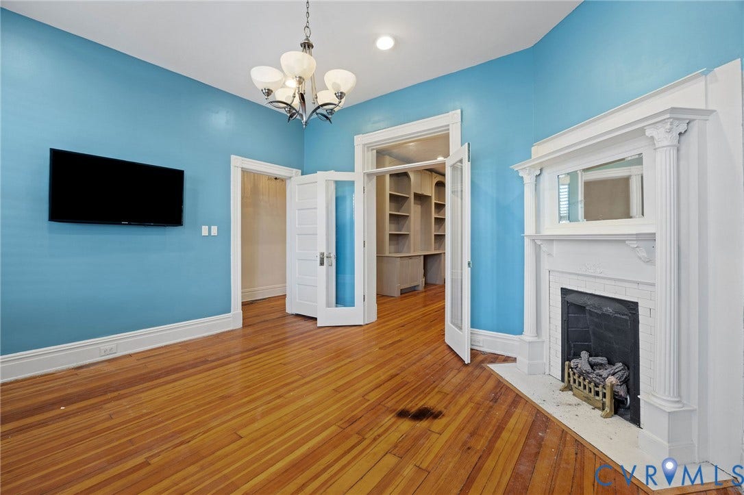 5 S Adams Street, Richmond, VA 23220 Unfurnished living room with hardwood / wood-style floors, a chandelier, a fireplace, and recessed lighting