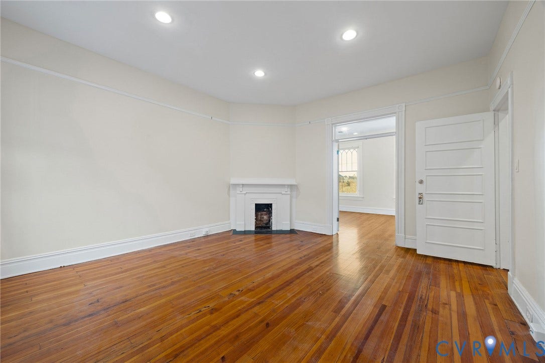 5 S Adams Street, Richmond, VA 23220 Unfurnished living room with hardwood / wood-style flooring, a fireplace with flush hearth, and recessed lighting
