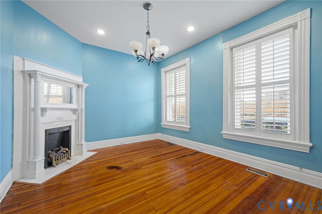 5 S Adams Street, Richmond, VA 23220 Unfurnished living room with wood-type flooring, a brick fireplace, recessed lighting, plenty of natural light, and a chandelier
