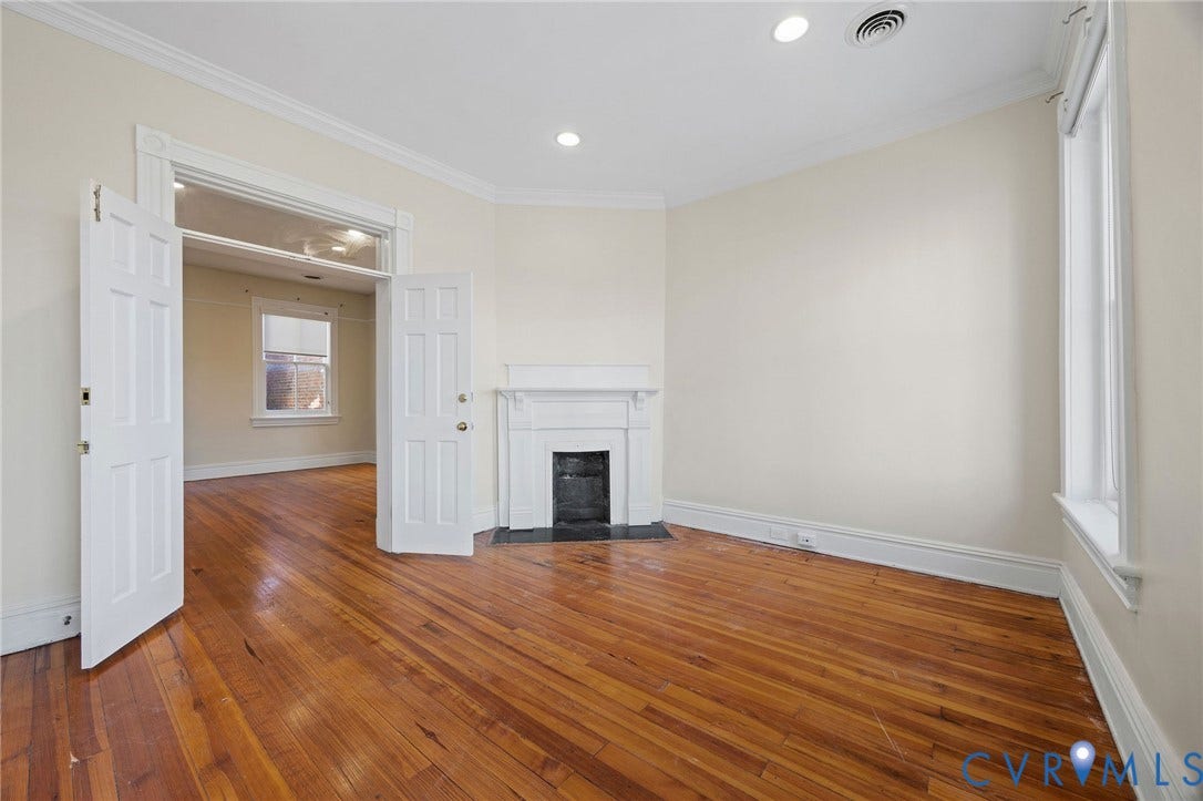 5 S Adams Street, Richmond, VA 23220 Unfurnished living room featuring crown molding, a fireplace with flush hearth, wood-type flooring, and recessed lighting