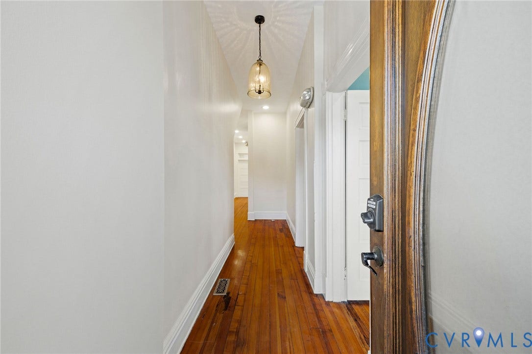 5 S Adams Street, Richmond, VA 23220 Corridor featuring dark wood finished floors and a chandelier
