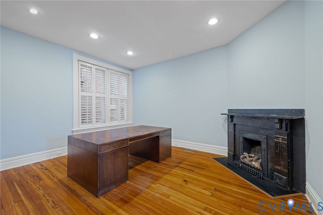 5 S Adams Street, Richmond, VA 23220 Unfurnished office with a fireplace with flush hearth, recessed lighting, and light wood-style floors