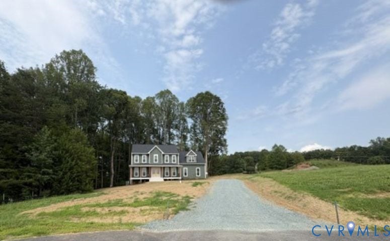 162 Bacon Bit Ln, Louisa, VA 23093 Classic Colonial-style residence set on expansive grounds with mature tree line, long paved driveway approach, and open pasture acreage