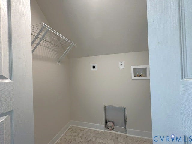 162 Bacon Bit Ln, Louisa, VA 23093 Utility area featuring hexagonal floor tiling, wall-mounted wire shelving, and appliance hookups