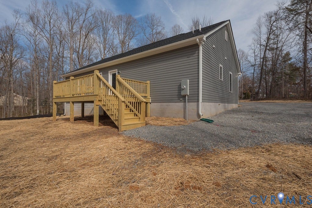 2513 Callies Way, Goochland, VA 23063 View of home's exterior featuring a wooden deck and stairs