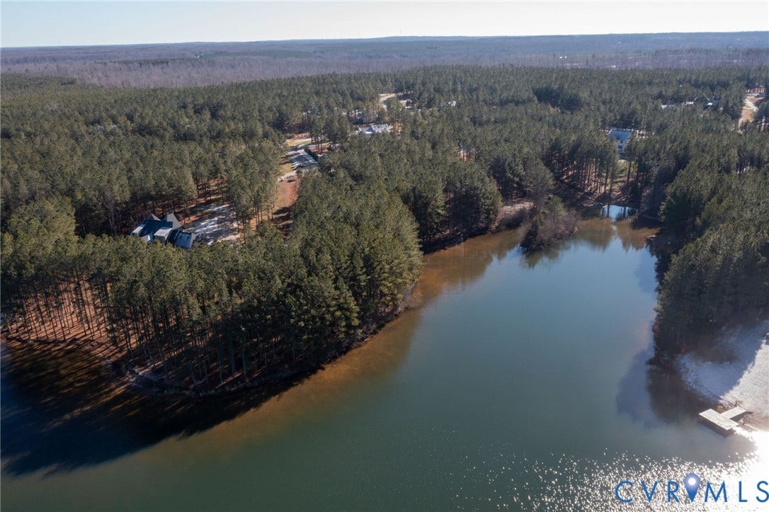 3739 Mill Mount Turn, Westlake At Mill Mount Sec2, Powhatan, VA 23139 Aerial view of property and surrounding area featuring a heavily wooded area and a large body of water