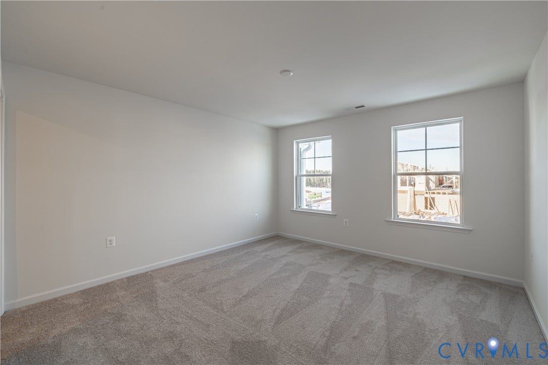 505 Bayberry Lane, Spring Creek, Zion Crossroads, VA 22942 Bedroom two, featuring a walk-in closet, and bedroom three, offering a spacious double-door closet, share a full hall bath with a tub/shower combo.