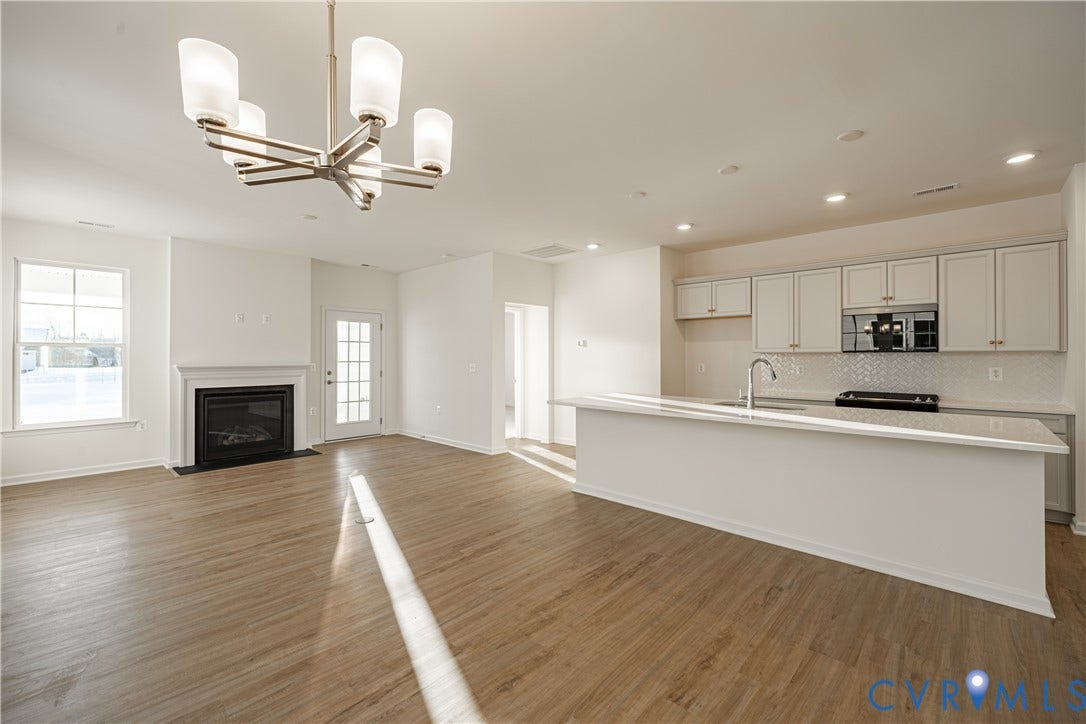 505 Bayberry Lane, Spring Creek, Zion Crossroads, VA 22942 The adjoining dining area features a chandelier and provides the perfect space for everyday living and entertaining.