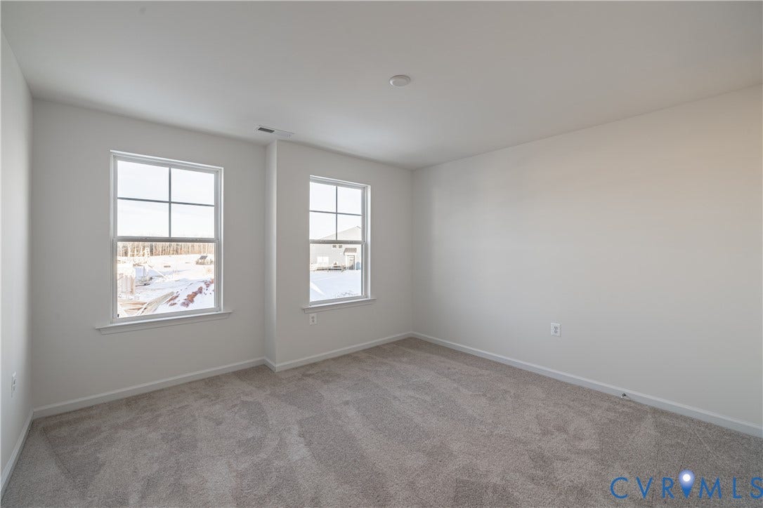 505 Bayberry Lane, Spring Creek, Zion Crossroads, VA 22942 Bedroom two, featuring a walk-in closet, and bedroom three, offering a spacious double-door closet, share a full hall bath with a tub/shower combo.