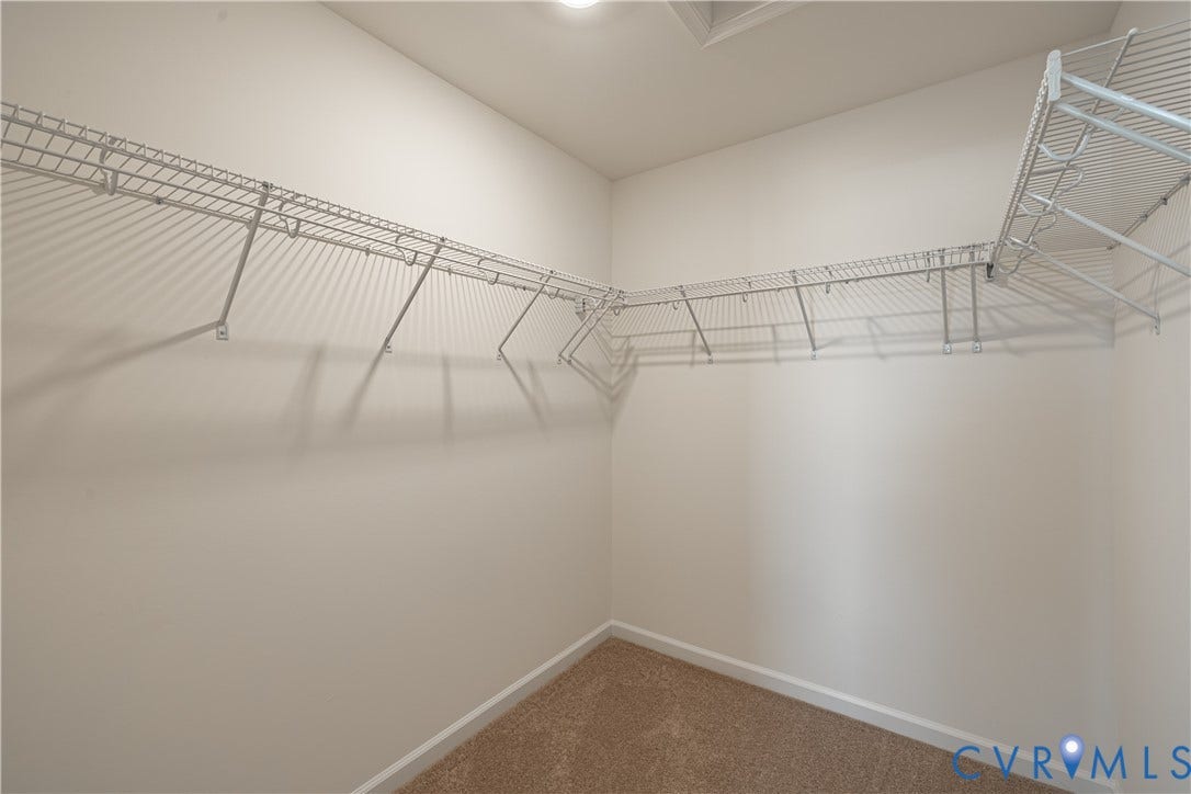 505 Bayberry Lane, Spring Creek, Zion Crossroads, VA 22942 Bedroom two, featuring a walk-in closet, and bedroom three, offering a spacious double-door closet, share a full hall bath with a tub/shower combo.