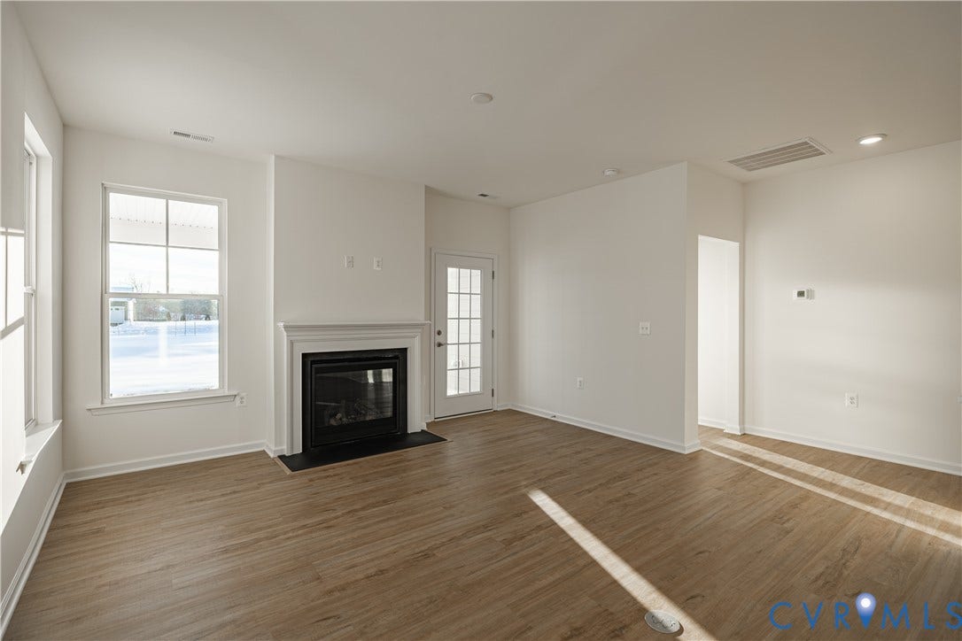 505 Bayberry Lane, Spring Creek, Zion Crossroads, VA 22942 Natural light pours into the great room from several large windows overlooking the covered patio. A gas fireplace completes the great room.