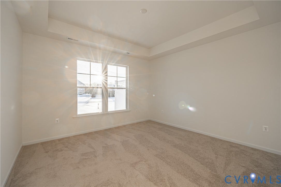 505 Bayberry Lane, Spring Creek, Zion Crossroads, VA 22942 Tucked at the back of the home is the FIRST-FLOOR primary suite featuring a spacious walk-in closet, a tray ceiling, and an ensuite LUXURY bath with a curbless walk-in shower and a double vanity.
