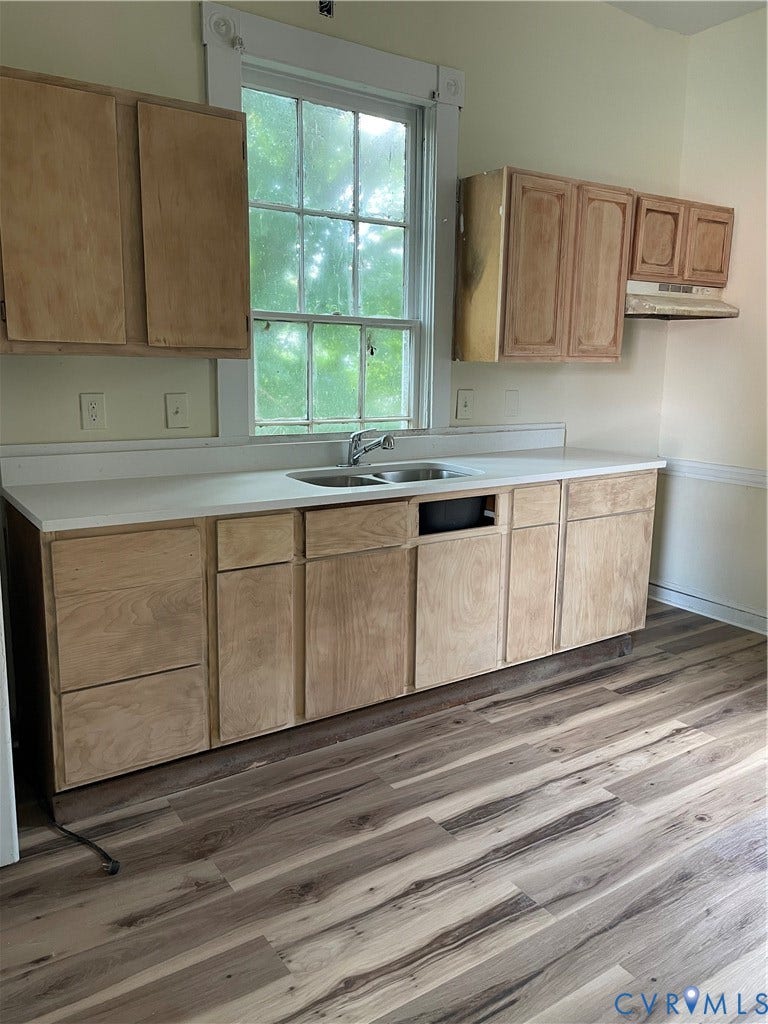 712 W Washington Street, #B, Petersburg, VA 23803 Kitchen space featuring wood-finish flooring and light-toned walls