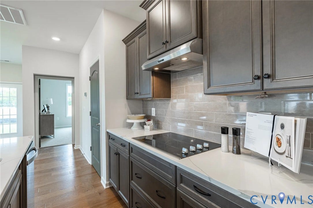 378 Bayberry Lane, Spring Creek, Zion Crossroads, VA 22942 The heart of the home is the spacious kitchen, featuring a large center island, granite countertops, a tile backsplash, stainless steel appliances, and an ample pantry.
