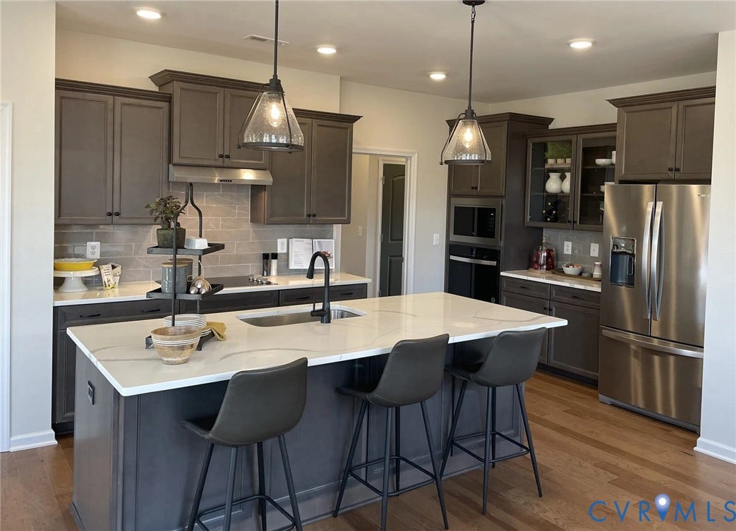 378 Bayberry Lane, Spring Creek, Zion Crossroads, VA 22942 The heart of the home is the spacious kitchen, featuring a large center island, granite countertops, a tile backsplash, stainless steel appliances, and an ample pantry.