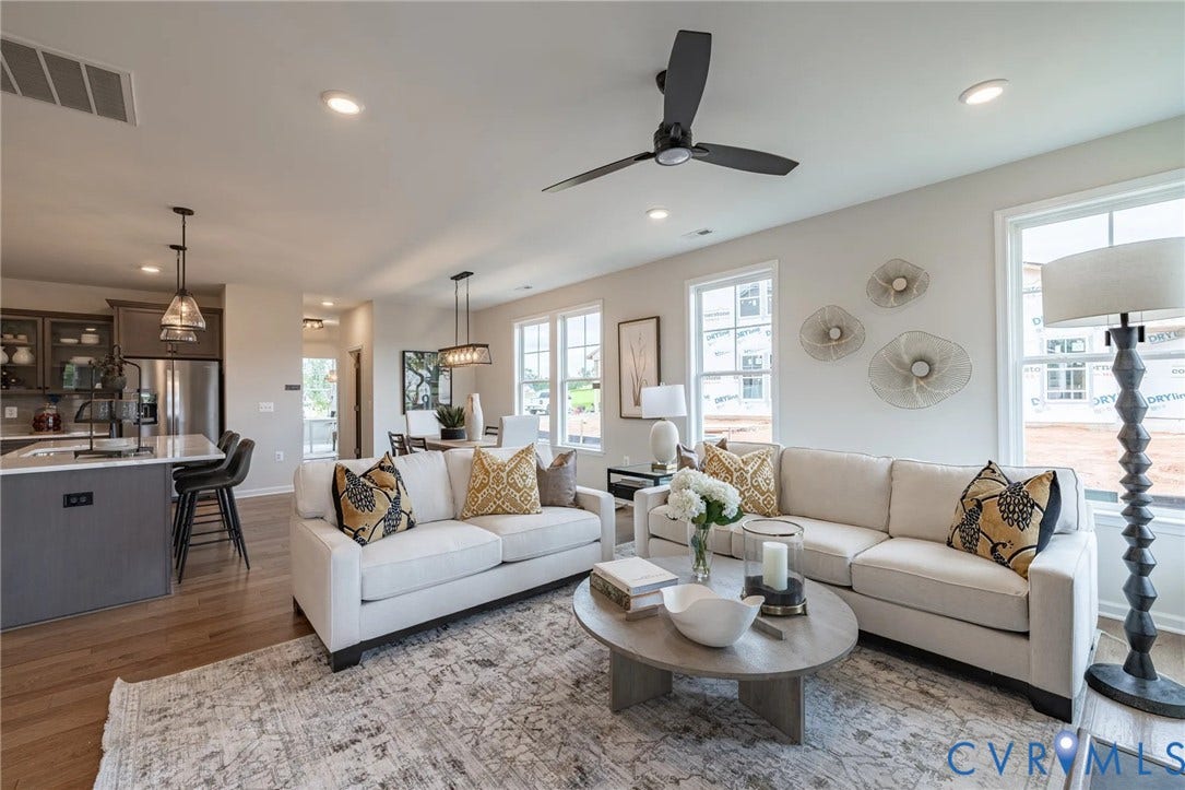 378 Bayberry Lane, Spring Creek, Zion Crossroads, VA 22942 Natural light pours into the great room from several large windows overlooking the covered patio. A gas fireplace completes the great room.