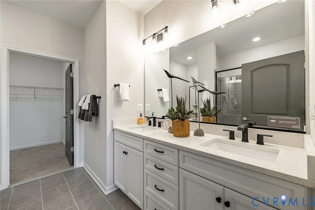 378 Bayberry Lane, Spring Creek, Zion Crossroads, VA 22942 Tucked at the back of the home is the FIRST-FLOOR primary suite featuring a spacious walk-in closet, a tray ceiling, and an ensuite LUXURY bath with a curbless walk-in shower and a double vanity.