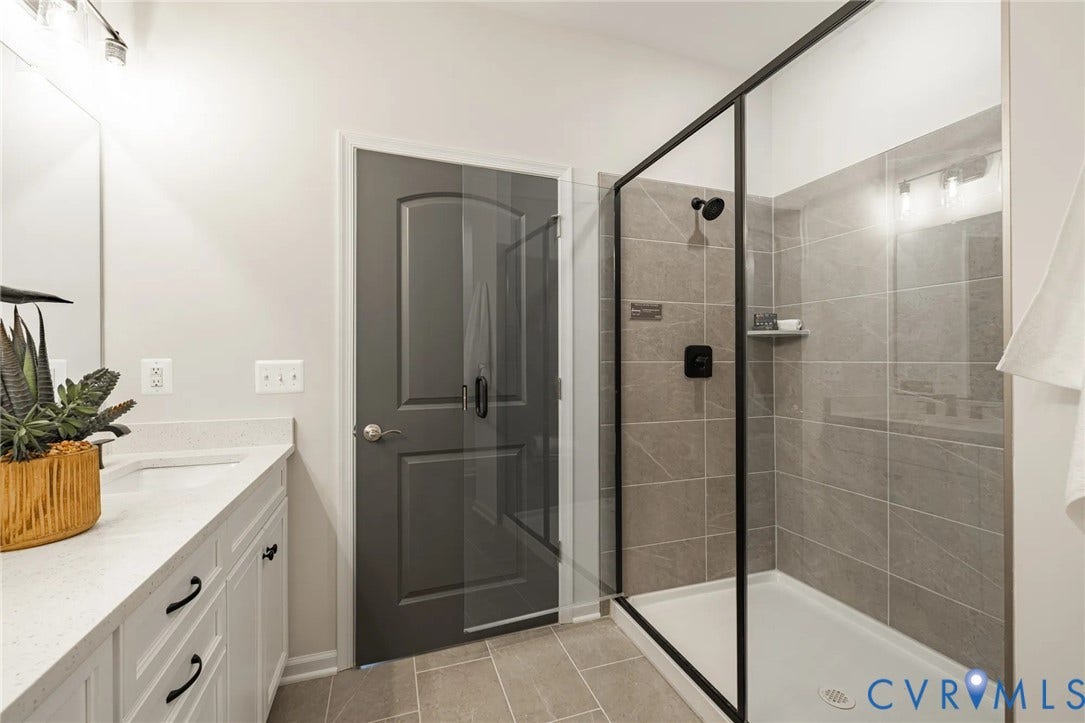 378 Bayberry Lane, Spring Creek, Zion Crossroads, VA 22942 Tucked at the back of the home is the FIRST-FLOOR primary suite featuring a spacious walk-in closet, a tray ceiling, and an ensuite LUXURY bath with a curbless walk-in shower and a double vanity.