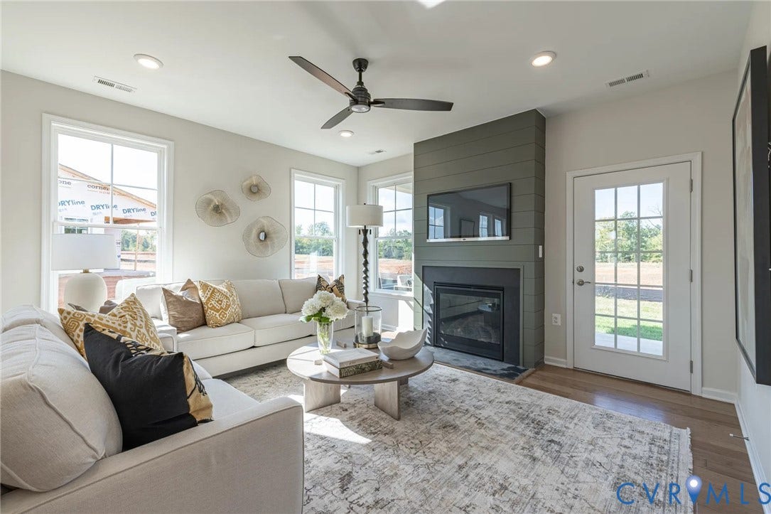 378 Bayberry Lane, Spring Creek, Zion Crossroads, VA 22942 Natural light pours into the great room from several large windows overlooking the covered patio. A gas fireplace completes the great room.