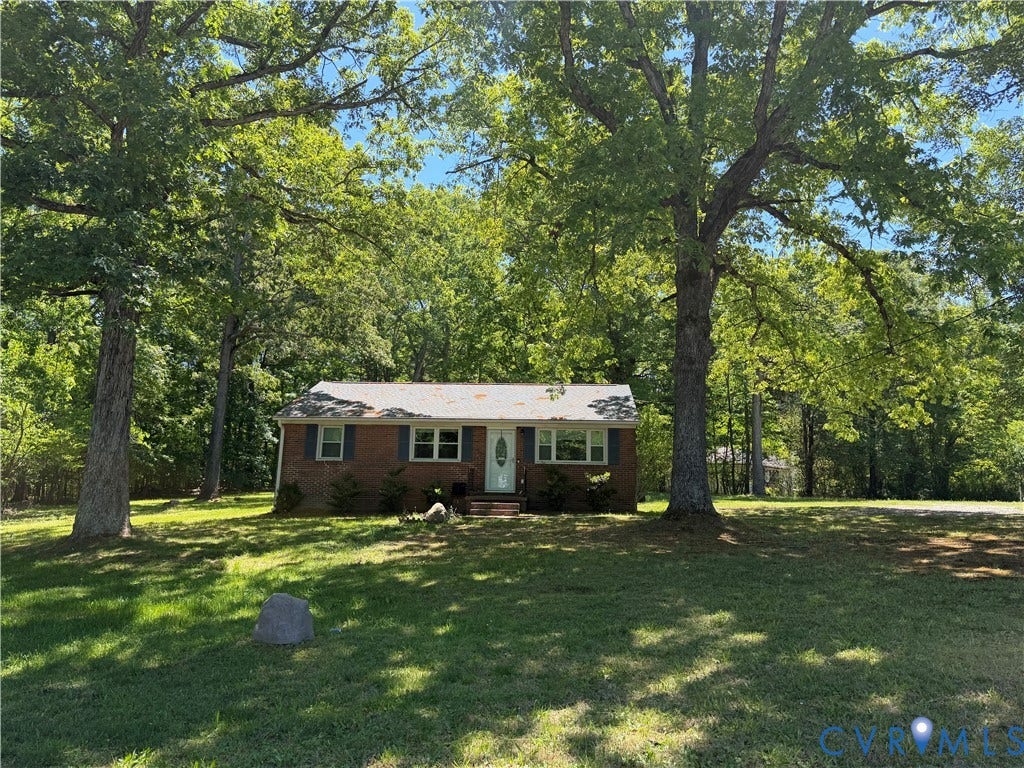 1611 Anderson Highway, Powhatan, VA 23139 Brick exterior with white trim, featuring a white entry door with frosted glass accents