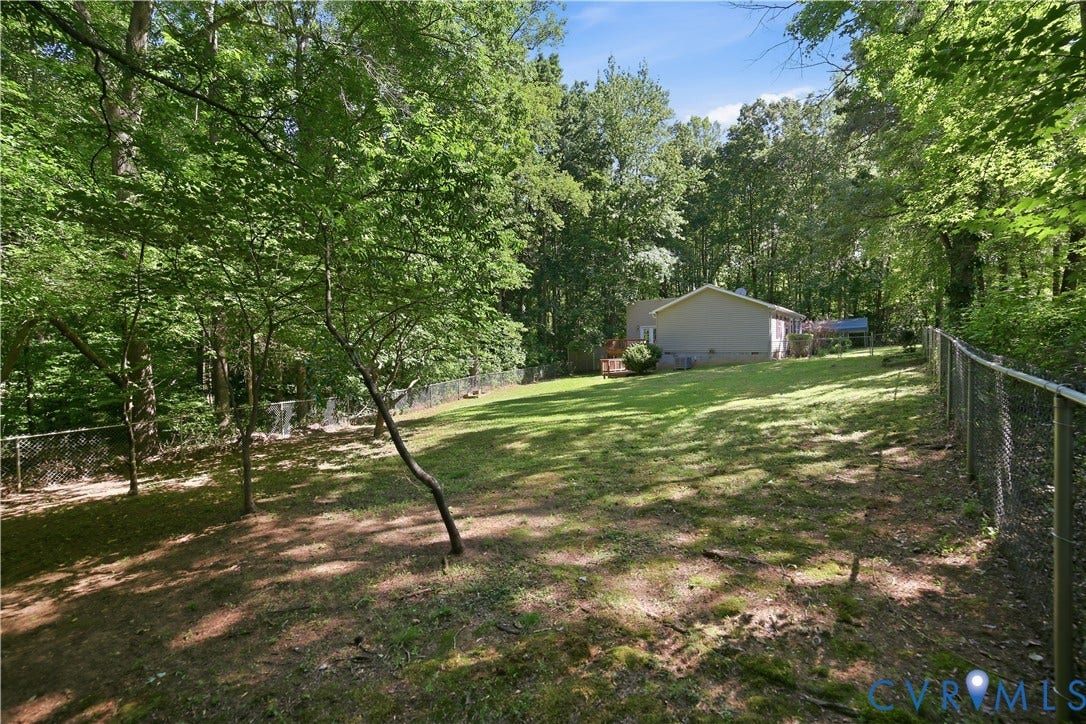 1637 Gardners Road, Mineral, Mineral, VA 23117 Expansive, fenced backyard with a manicured lawn and mature trees