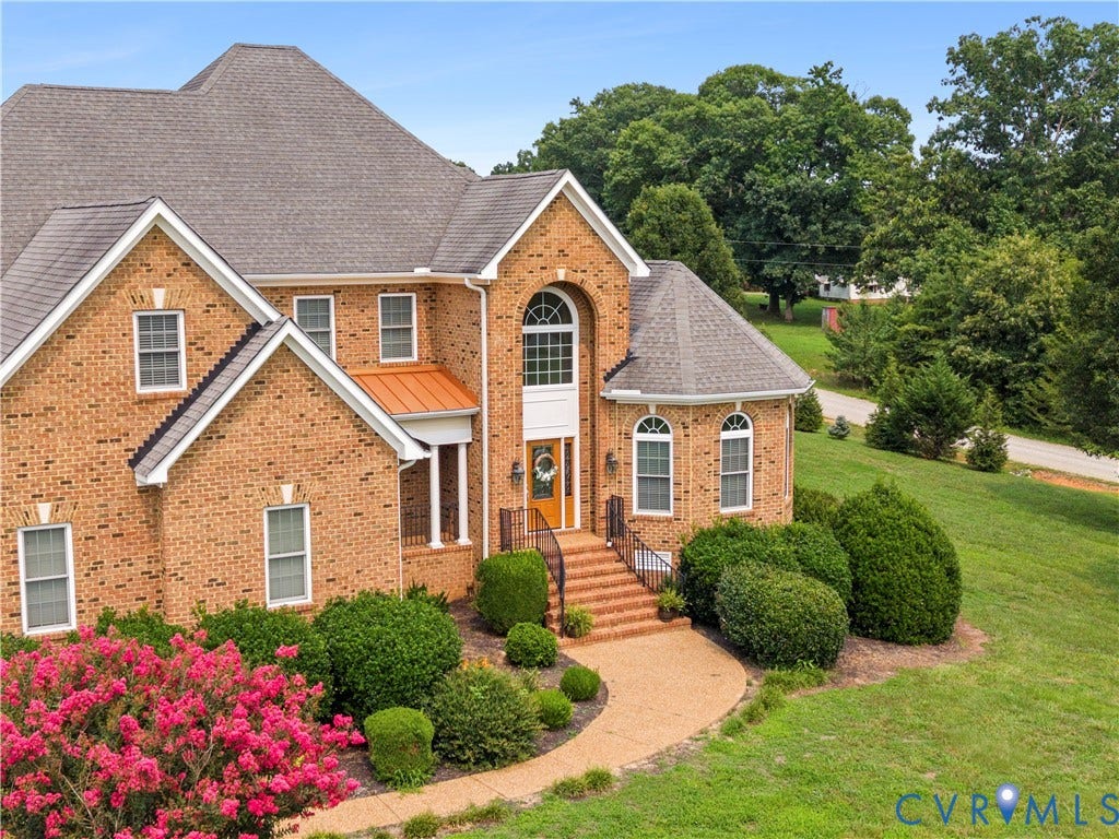 270 Petersburg Road, 4.34 Acre Lot - No Hoa, Powhatan, VA 23139 Brick exterior with a prominent arched entry, a copper-colored accent roof, and a gabled roofline