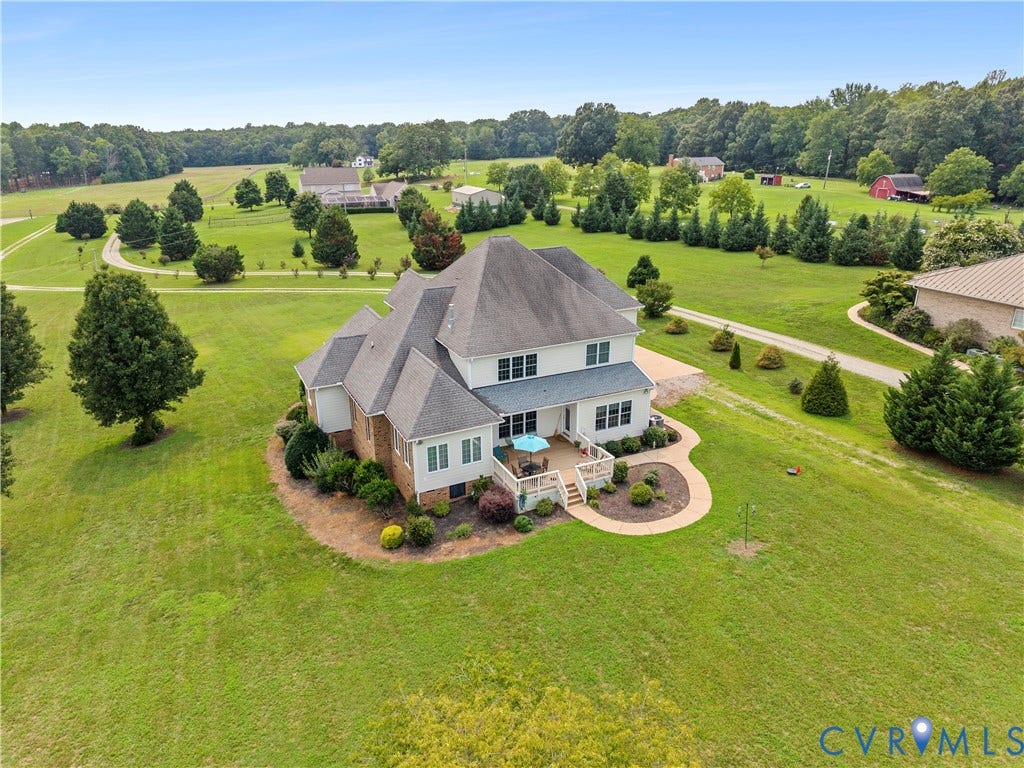270 Petersburg Road, 4.34 Acre Lot - No Hoa, Powhatan, VA 23139 Expansive property featuring a multi-level residence with a brick and siding exterior, a large rear deck, and a curved patio area
